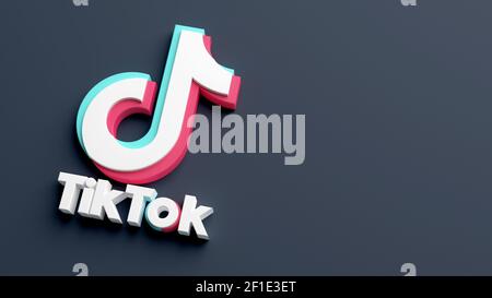 Valencia, Spain - March, 2021: TikTok logo isolated on a dark background and copy space in 3D rendering. Close-up of Tik Tok application logo. Tiktok Stock Photo