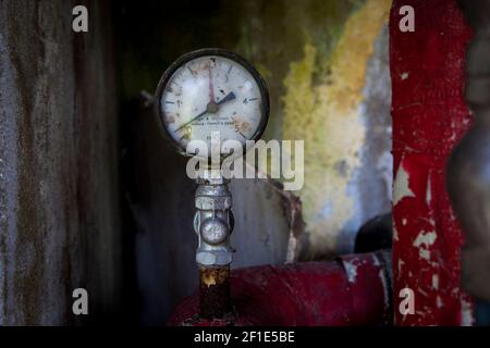 Closeup of a old vintage and rustic red pump Stock Photo