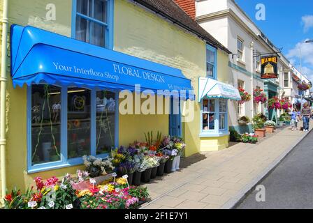 Florist shop and Bell Pub, West Street, New Alresford, Hampshire, England, United Kingdom Stock Photo