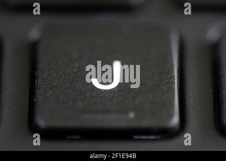 J key on a laptop keyboard Stock Photo