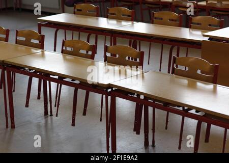 An empty children classroom with chairs and tables Stock Photo