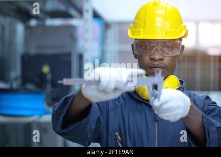 Using Vernier caliper to measure the dimensions thickness of the Pipe Fittings. safety and health accessories for employees and measuring Stock Photo
