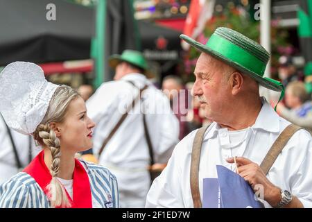 Cheese vendors in traditional costume at Alkmaar Cheese Market, Netherlands Stock Photo