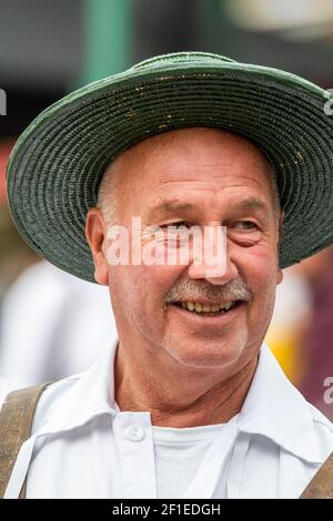 Cheese vendors in traditional costume at Alkmaar Cheese Market, Netherlands Stock Photo