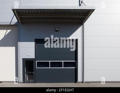 Rolling gate or roller shutter used for factory, warehouse or hangar. Stock Photo