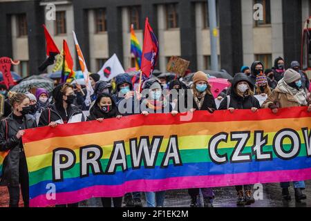 Gdansk, Poland 7th, March 2021 Protesters with feminist , pro-choice banners and LGBT movement rainbow flags are seen in Gdansk, Poland on 7 March 2021 The Manifa is annual feminist and woman rights rally to celebrate International Women's Day - a global day celebrating the social, economic, cultural and political achievements of women. Protesters demand woman rights, respect, and free choice of abortion. Credit: Vadim Pacajev/Alamy Live News Stock Photo