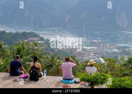 Koh Phi Phi Island, Thailand - December 29 2017: Backpacker tourists group enjoying scenic view Stock Photo