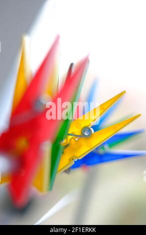colourful plastic clothes line pegs Stock Photo
