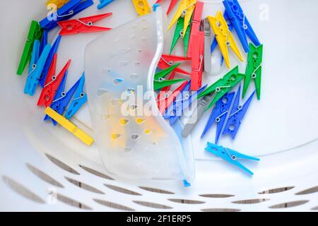 colourful plastic clothes line pegs Stock Photo