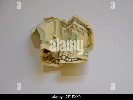 A US five dollar bill crumpled and screwed up Stock Photo