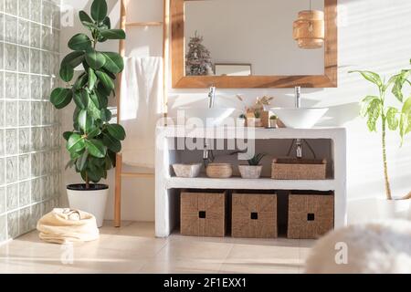 Stylish modern interior of a bright, sunny bathroom Stock Photo