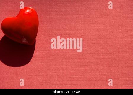 lovely Happy Valentines day concept with red heart shape on red paper sheet Stock Photo