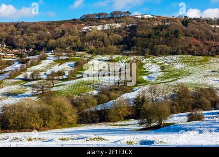 Snow covered landscape with trees at Starkholmes near Matlock Bath in the Derbyshire Peak District England UK Stock Photo