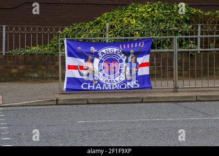 Newtownards, UK. 8 March 2021 A victory banner tied to a road safety crossing barrier in George Street Newtownards celebrating Glasgow Rangers famous Scottish Premier League victory on 7 March 2021. Credit: MHarp/Alamy Live News Stock Photo