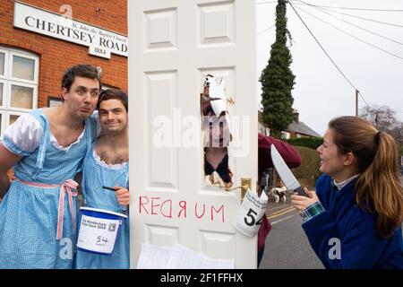 Competitors take part in the annual Windlesham Boxing  Day Pram Race in fancy dress. The charity event which started over 40 years ago sees runners complete a 3.5 mile course through Windlesham village in Surrey stopping at local pubs along the way. Photo credit should read: Katie Collins/EMPICS/Alamy Stock Photo