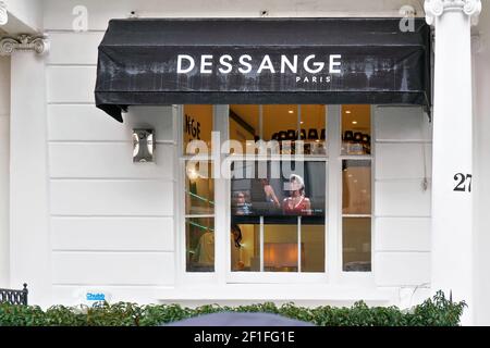 London, United Kingdom - February 01, 2019: Dessange Paris logo on black window shade of their branch at South Kensington. It is chain of luxury femal Stock Photo