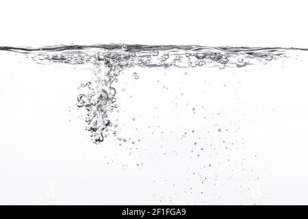 Water poured into tank, bubbles and splashes visible on white background Stock Photo