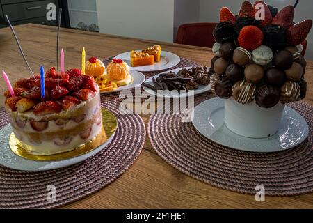 Birthday cake with strawberries and other candies Stock Photo - Alamy
