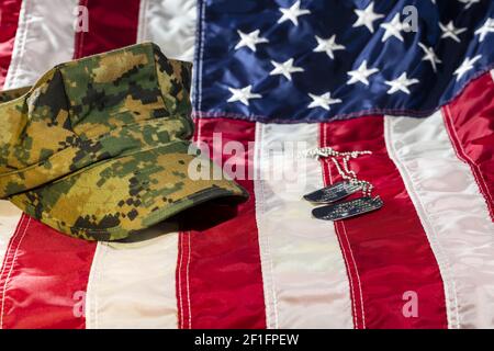 American Flag With Military Cover and Dog Tags Stock Photo - Alamy