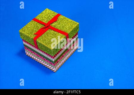 Small Christmas Gift Box On Blue Background Stock Photo