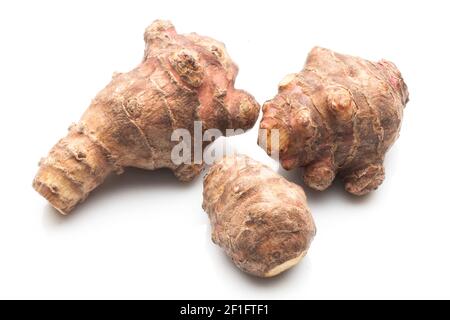 Topinambur or Jerusalem artichoke (Helianthus tuberosus) isolated on white background Stock Photo