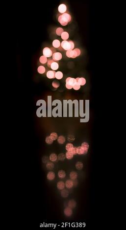 Abstract christmas background with defocused lights lights isolated on black Stock Photo