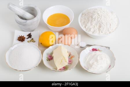 Various ingredients for baking cake. Located on a white background. Stock Photo