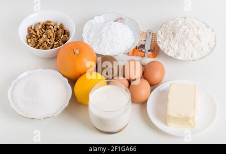 Various ingredients for baking cake. Located on a white background. Stock Photo