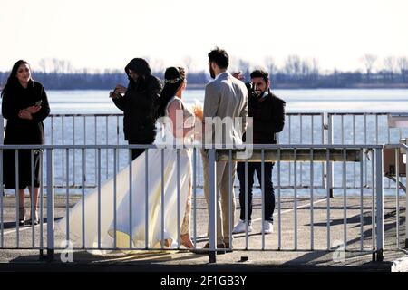 March 5,2021 in Hamburg Germany. Wedding party on the platform of the ferry on the banks of the Elbe Editorial. Bride and selfie Stock Photo