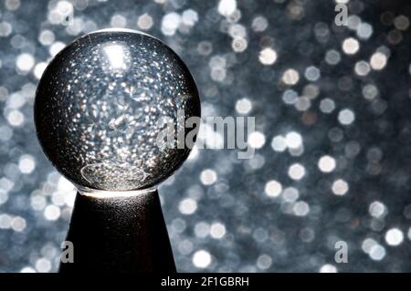 Crystal ball close-up view in light gray background Stock Photo