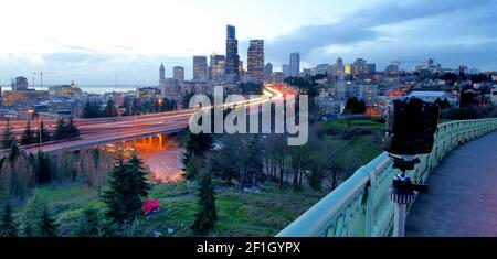 Bright Sunset Light Backlights The Seattle City Skyline in this Long Exposure Stock Photo