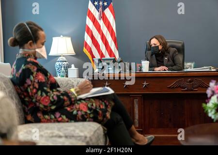 Vice President Kamala Harris talks on the phone with President of the Democratic Republic of Congo Félix Tshisekedi Friday, Feb. 26, 2021, in her West Wing Office of the White House. (Official White House Photo by Lawrence Jackson) Stock Photo