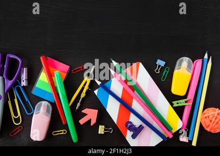 Colorful stationery on black background Stock Photo