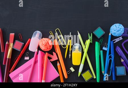 Colorful stationery on black background Stock Photo