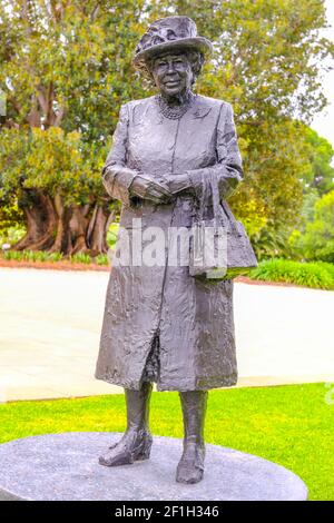 A statue of Queen Elizabeth standing in the grounds of the South Australian Government House in Adelaide Australia. Stock Photo
