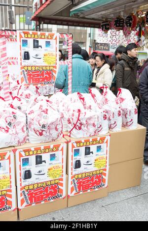 A shop selling mystery bags, or grab bags in the tradition of fukubukuro,  during New Years in Tokyo Stock Photo