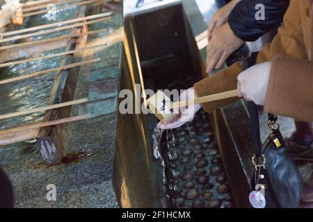Wooden ladles, Temizuya where people go to purify themselves before entering the Meiji Jingu Shrine Stock Photo