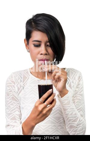 Beautiful asian woman drinking cola, isolated on white background Stock Photo