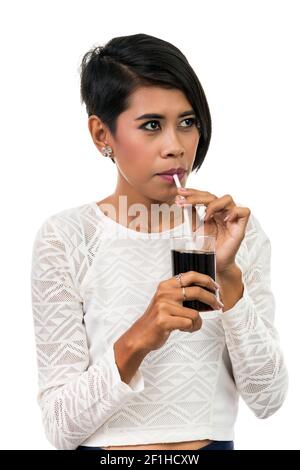 Beautiful asian woman drinking cola, isolated on white background Stock Photo