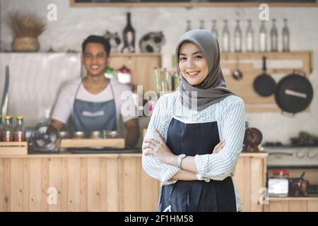 Successful muslim asian small business owner Stock Photo
