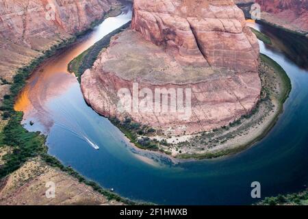 Motorboat going around Horseshoe Bend Stock Photo