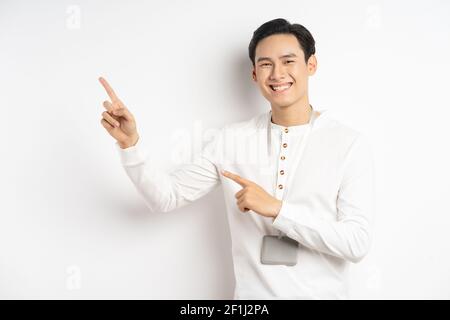 Asian businessman was pointing his hands up and smiling confidently Stock Photo