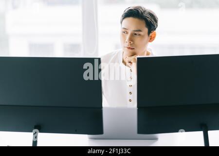 Asian programmers are focused on working to fulfill the assigned deadlines Stock Photo