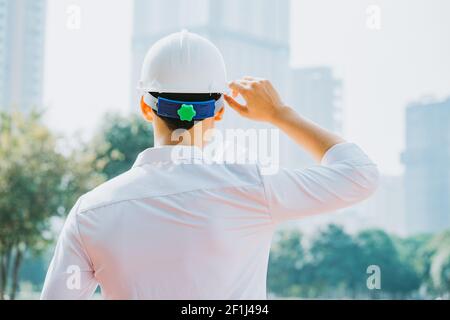 Image from behind of Asian construction engineers are doing experimental tests at the site Stock Photo