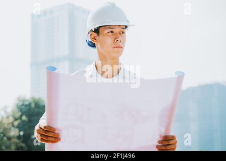 Asian construction engineers are doing experimental tests at the site Stock Photo