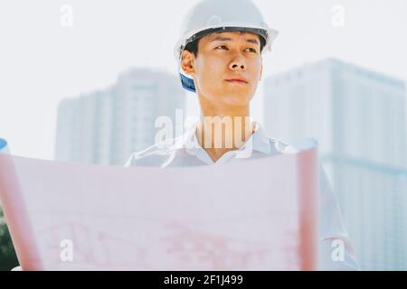 Asian construction engineers are doing experimental tests at the site Stock Photo