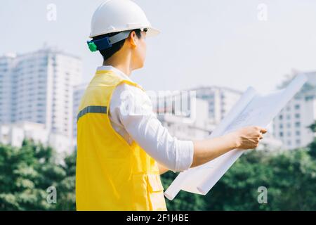 Asian construction engineers are doing experimental tests at the site Stock Photo