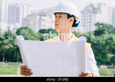 Asian construction engineers are doing experimental tests at the site Stock Photo