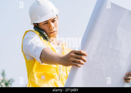 Asian construction engineers are doing experimental tests at the site Stock Photo