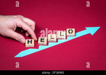 HELLO. Red arrow indicates the development and growth. Stock Photo